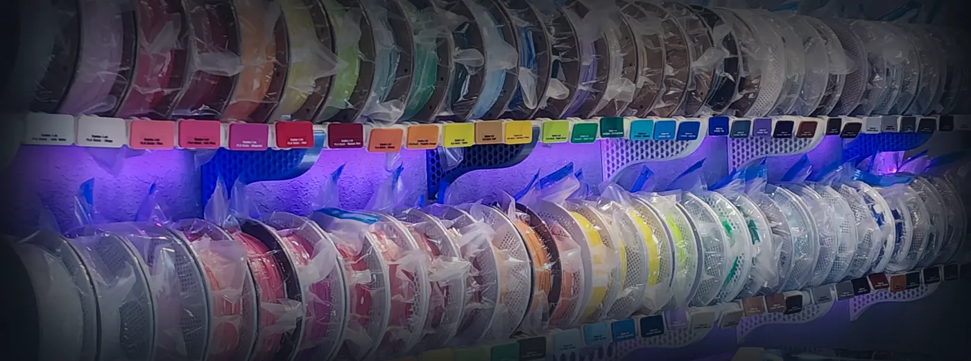 Kamio's filament collection, 416 spools on illuminated wall shelves
